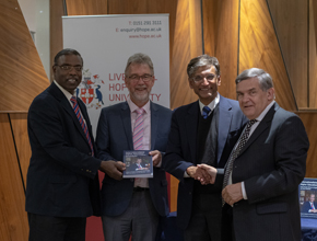 Professor Gerald Pillay shaking hands with other people